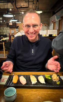 Diner Enjoying Sushi at Tokyo Restaurant