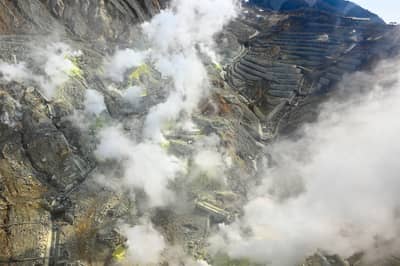 Active Volcanic Crater with Sulfur Vents and Steam