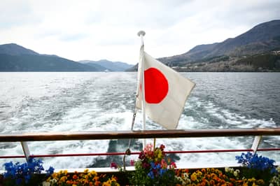 Japanese Flag on Sightseeing Boat Near Mount Fuji