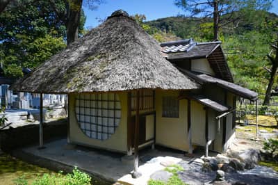 Traditional Thatched-Roof Building in Kyoto Garden