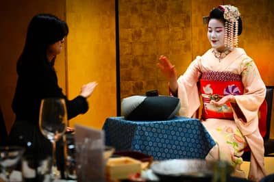 Maiko Serving Guest in Traditional Kyoto Interior
