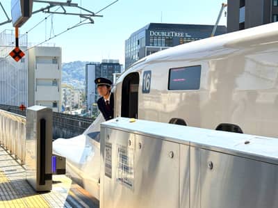 Shinkansen Conductor at Hiroshima Station Platform